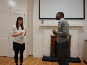 Toastmaster of the meeting John introducing Hannah on stage