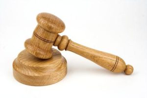 Use the gavel on wood